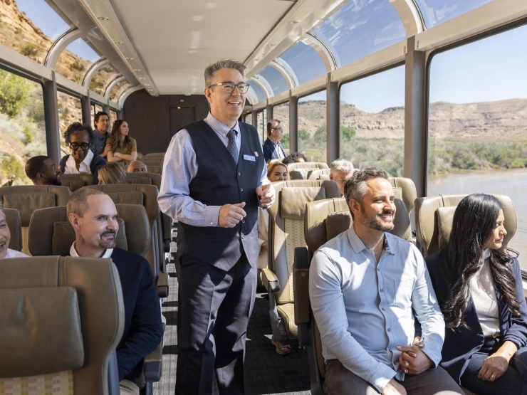Image of host on Canyon Spirit looking out with the tourists