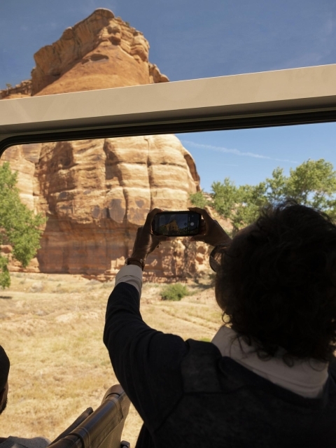 Image of a guest taking a picture of the canyons