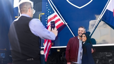 Image of two guests taking a picture outside the train 
